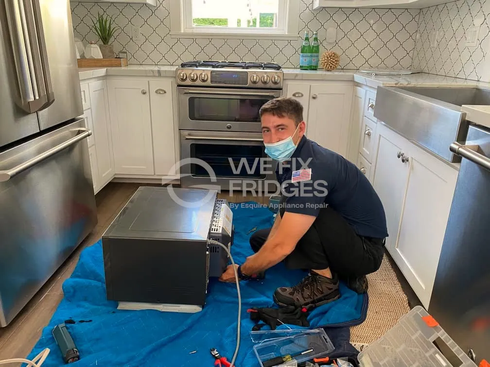 Ivan Hordiienko, owner of We Fix Fridges, in an Orange County kitchen