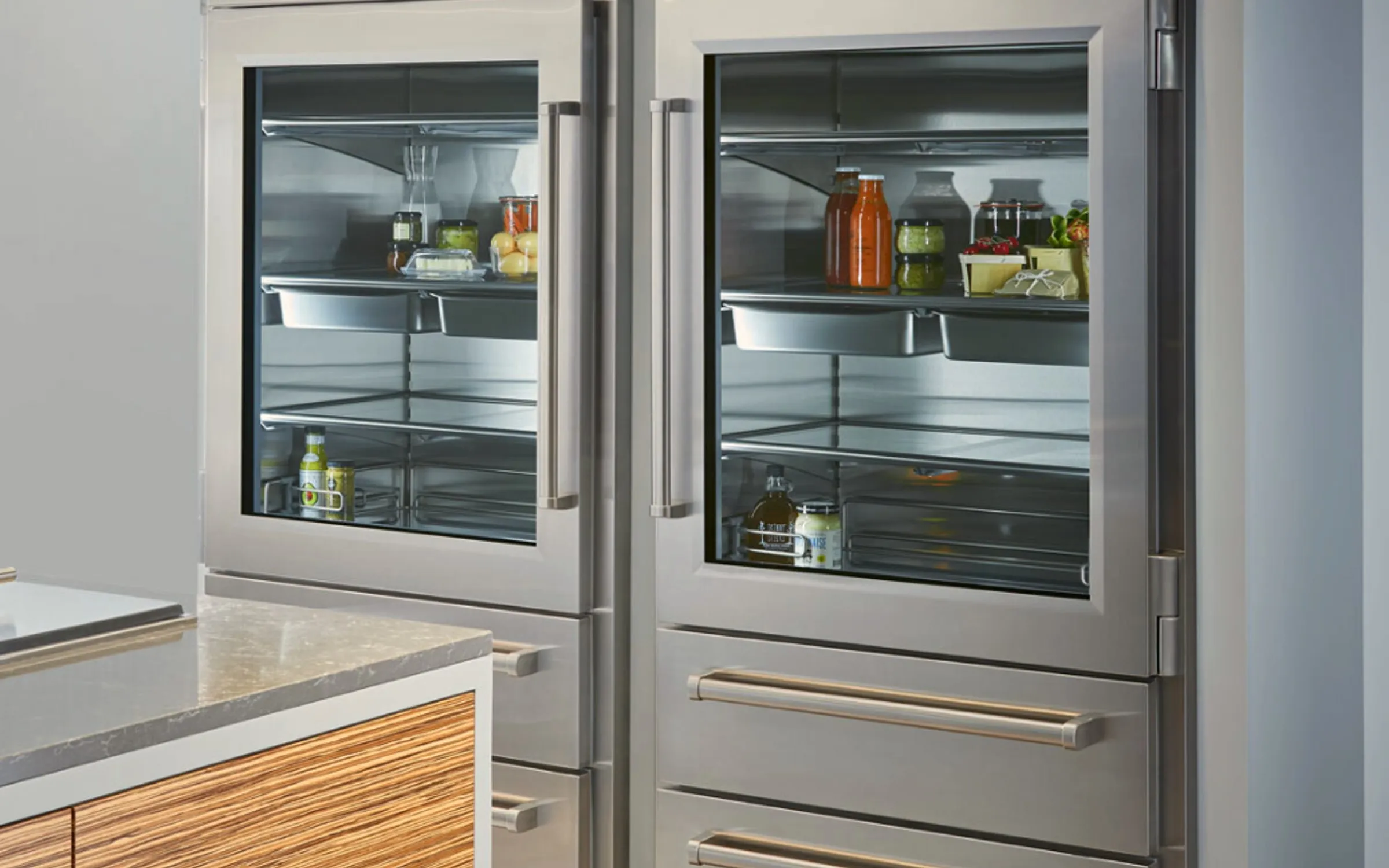 Sub-Zero 600 series built-in refrigerator with grille removed showing condenser fan motor in Huntington Beach CA